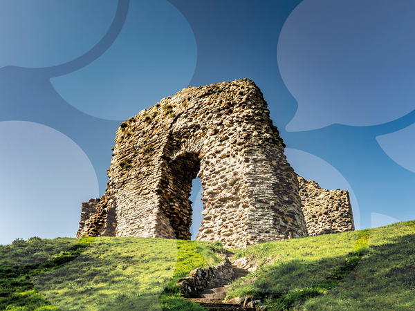 Ruins of the 12th century Christchurch Castle keep on a grassy motte in Dorset, England.